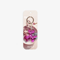 Helio-Ferretti-Schluesselanhaenger-Pink-METALLIC-PUPPY-Produkt-und-Verpackung