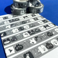 YUK-FUN-Gesichter-schwarz-weiss-Washi-Tape-15mmx10m-Produktansicht-32-Motive-auf-ein-PApier-geklebt