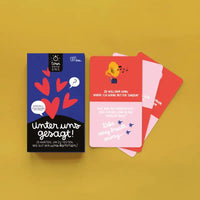 Unter-uns-gesagt-KArtenspiel-Minus-Edition-Spielkartenbox-cover-vorn-und-Fragekarten
